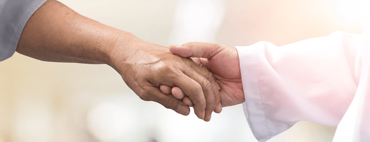 close up of two hands clasping
