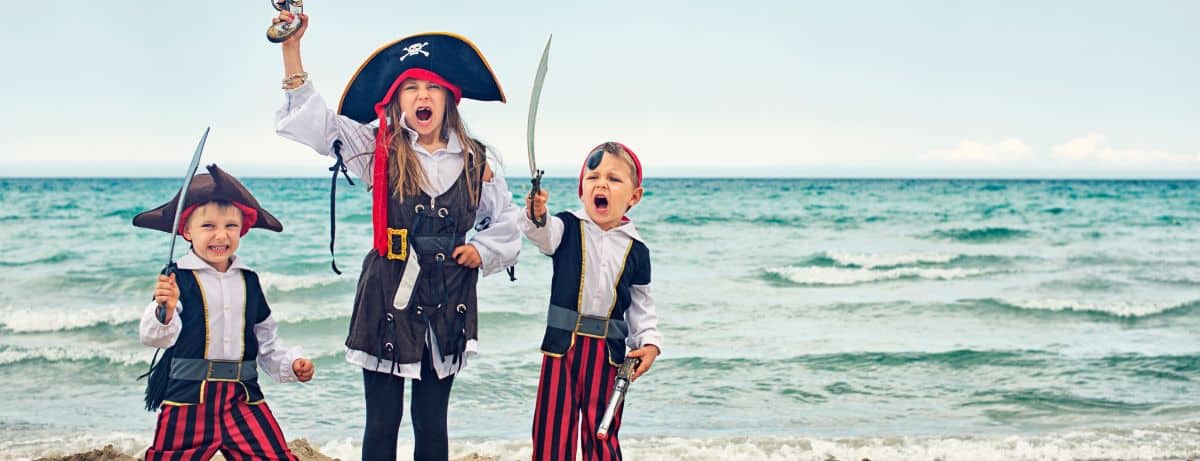 3 kids dressed up like pirates