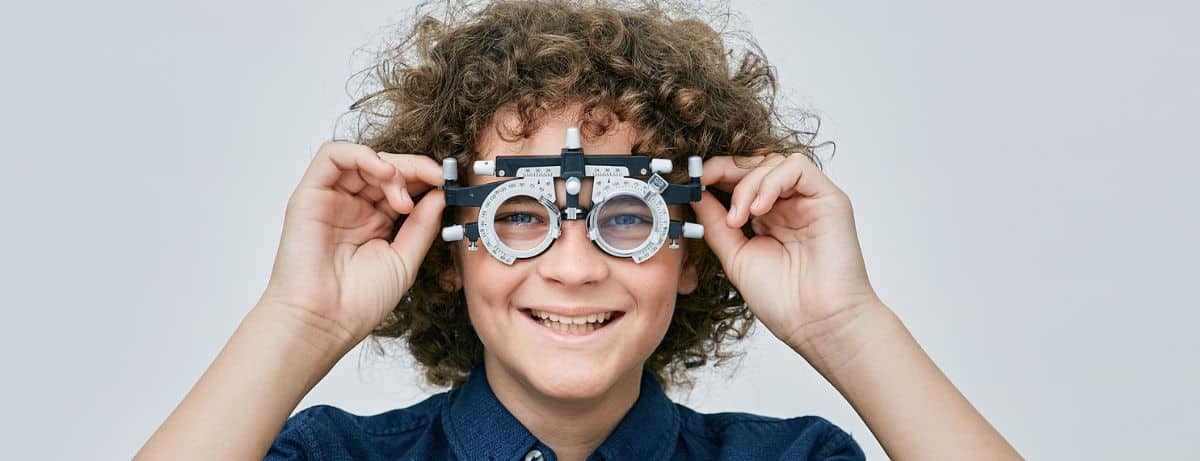 young boy testing vision for eye care